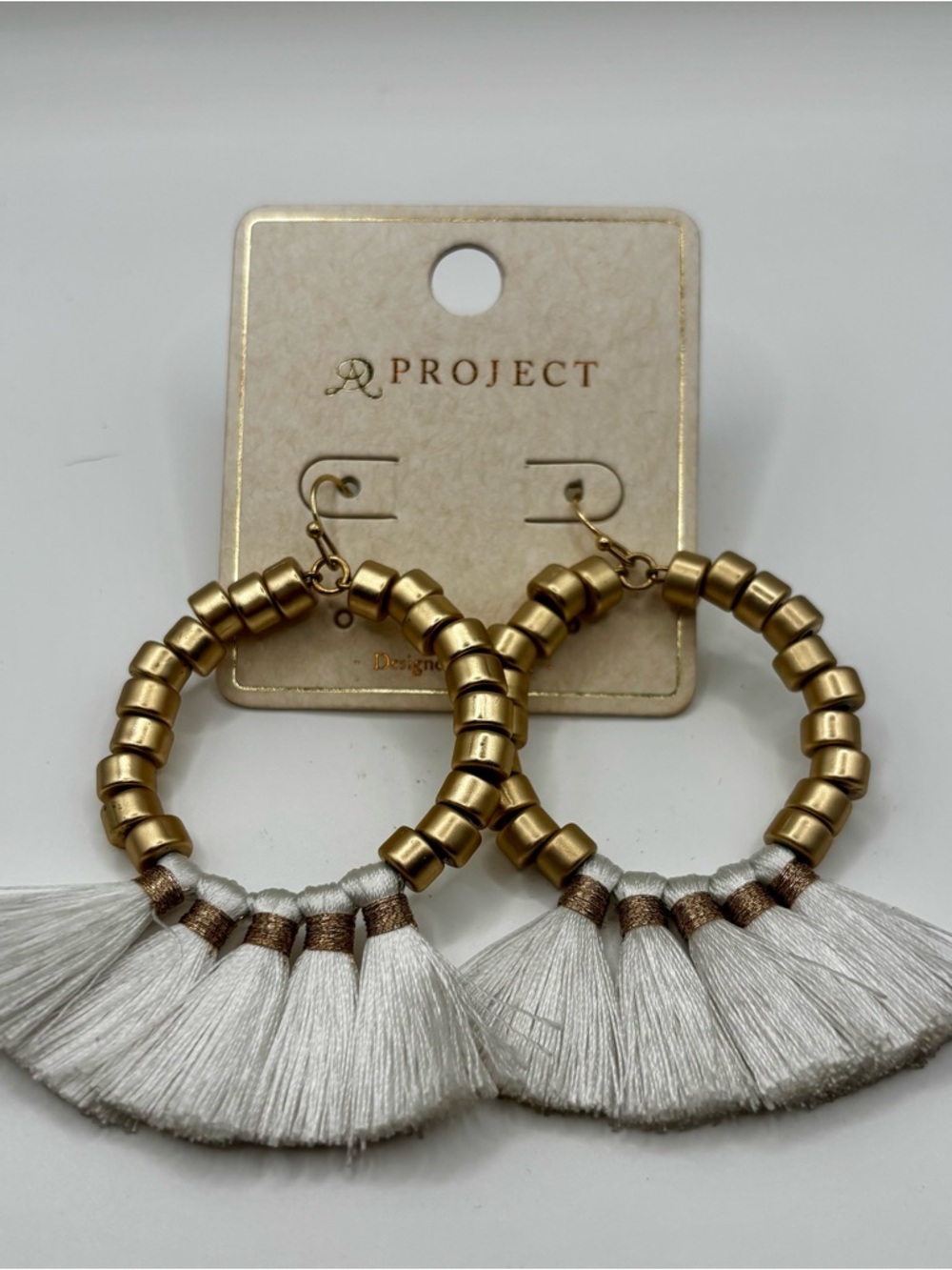 A Project Gold Beaded Hoop Earrings with White Tassel Fringe